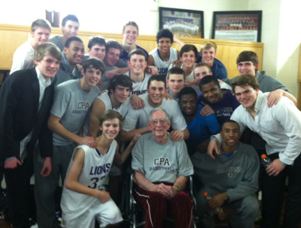 Basketball_Pappy Huggins cheers on the lions